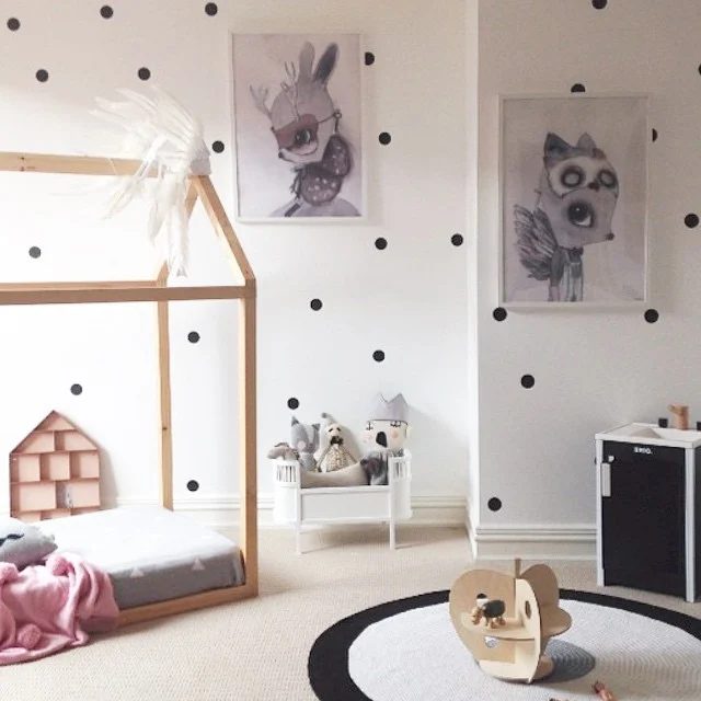 direct house floor bed frame in a girls room with polka dot walls via theposterclubkids