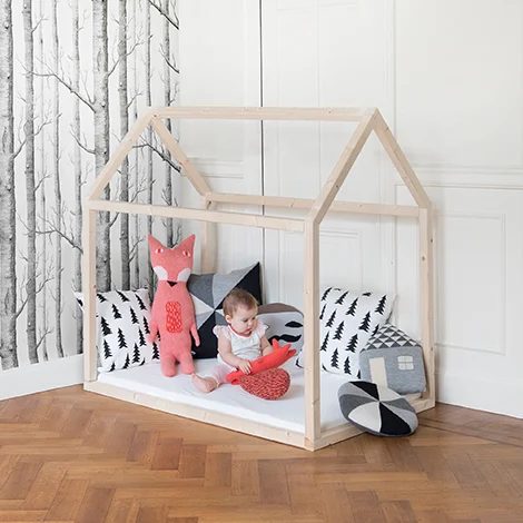 direct wood frame house floor bedframe for toddlers, with birch tree wallpaper via WoonBlog