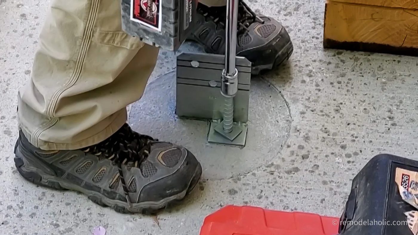 Drilling in Bolt to Hold Post Base to Concrete Footing