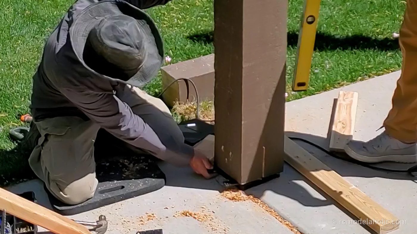 Adding Plastic Shims To Level The Posts over the Post Bracket