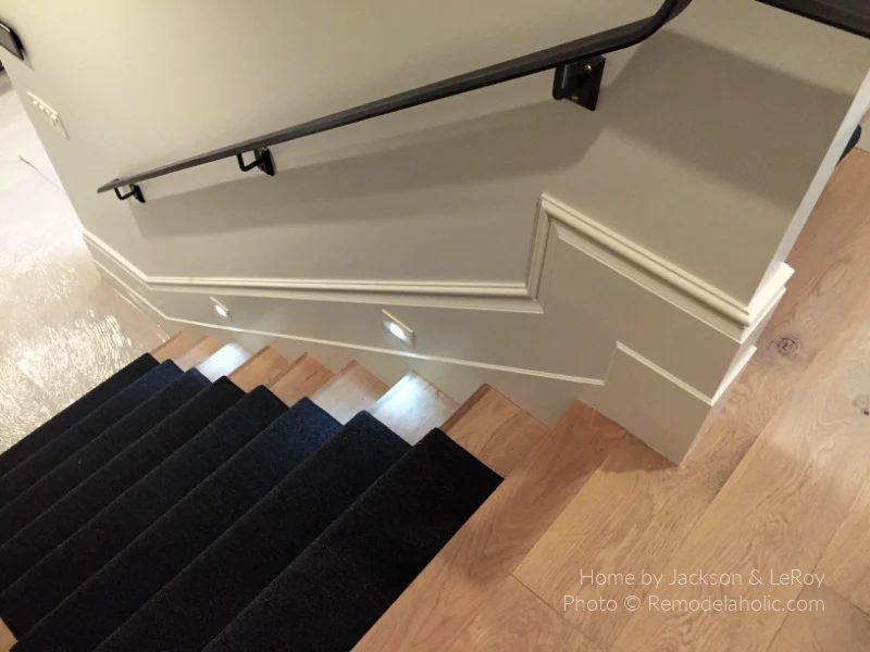 Stair Lights And Dark Black Carpeted Stair Runner On Medium Wood Staircase With Metal Handrail, Bekob UV16 H36