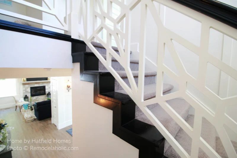 striking Custom Geometric White Stair Railing With Black Handrail And Stairs, Gray Carpeted Stair Runner Staircase, Bekob UV17 H18