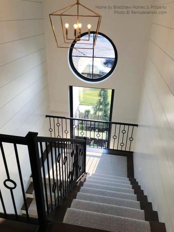 striking Staircase With Gray Geometric Runner Rug And Landing On Dark Wood Staircase Black Metal Railing, Bekob SL18 H06