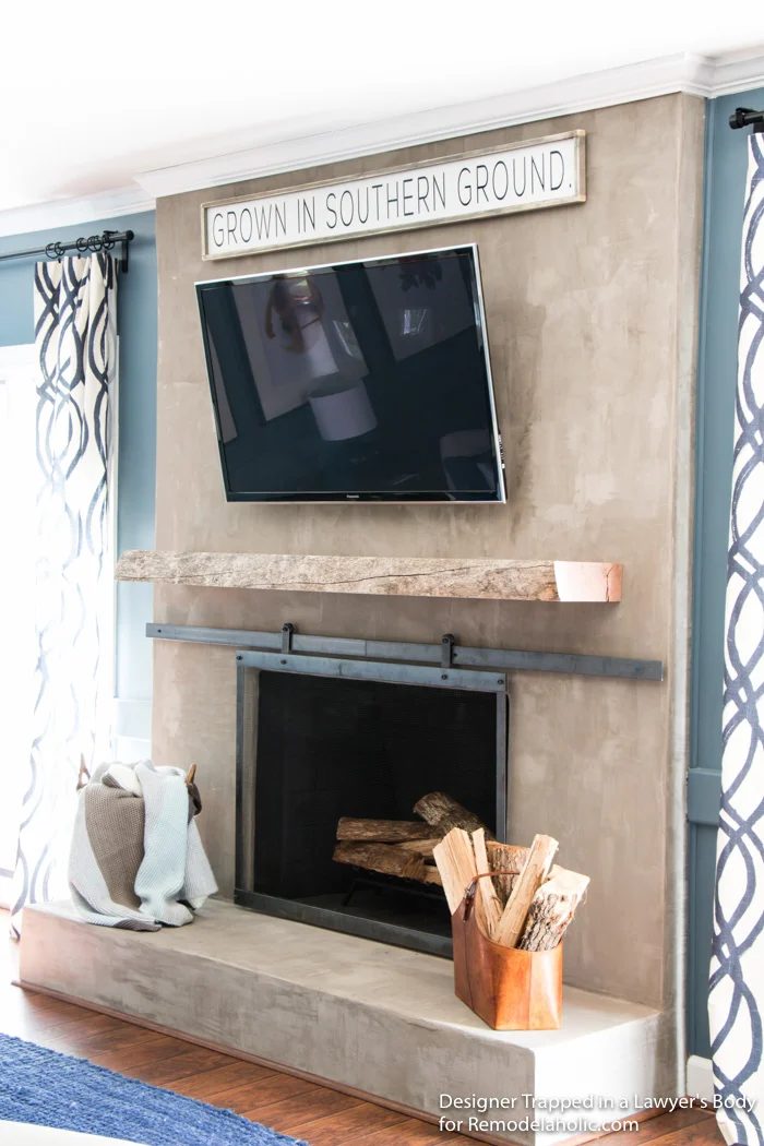 Handmade refaced concrete fireplace skim coat with wood mantel