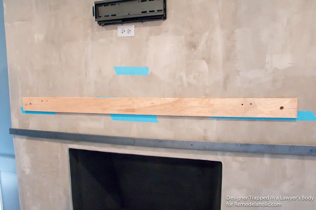 Learn how to install a wood mantel (even if it's clearly heavy) with this straightforward walkthrough from Designer Trapped in a Lawyer's Body for Bekob.com!