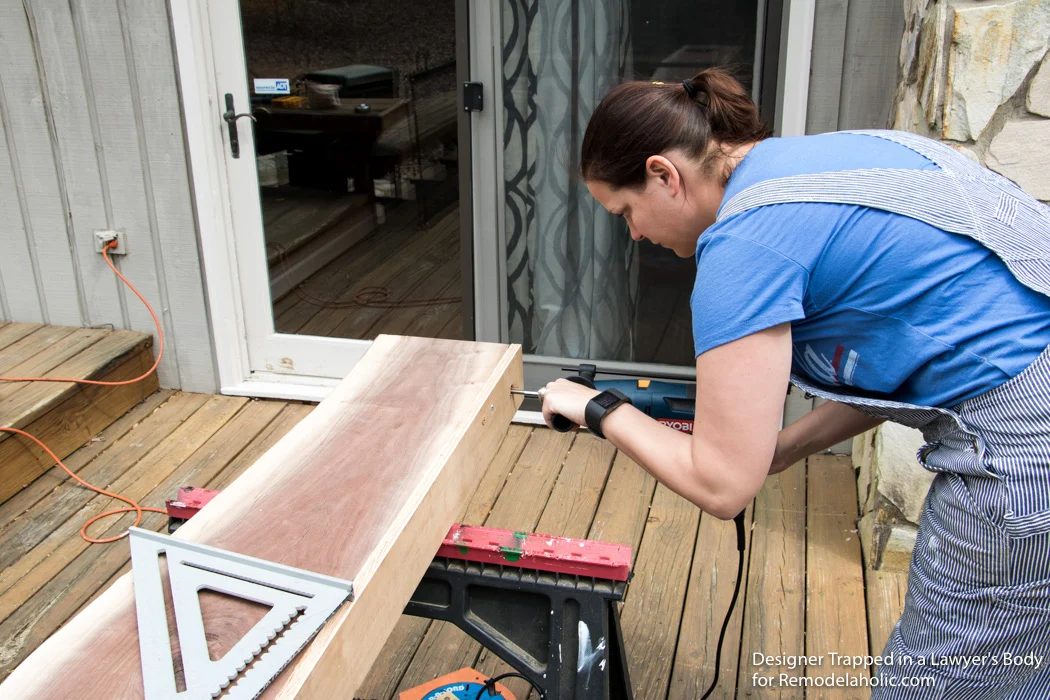 Learn how to install a wood mantel (even if it's clearly heavy) with this straightforward walkthrough from Designer Trapped in a Lawyer's Body for Bekob.com!
