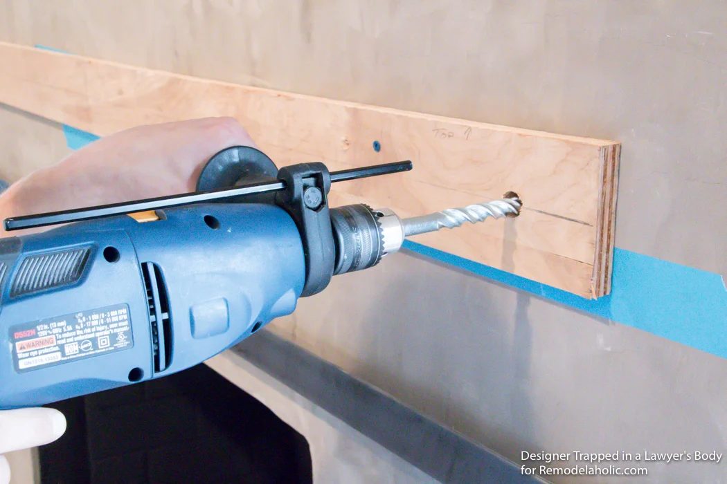 Learn how to install a wood mantel (even if it's clearly heavy) with this straightforward walkthrough from Designer Trapped in a Lawyer's Body for Bekob.com!