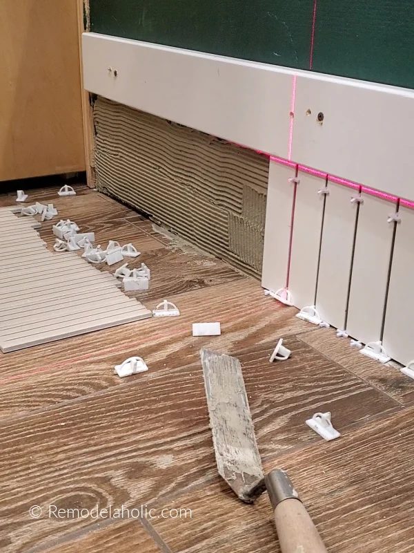 Wall Tile As Baseboard In Bathroom Use Laser Level And Spacers For Accurate Straight Tile Placement Bekob
