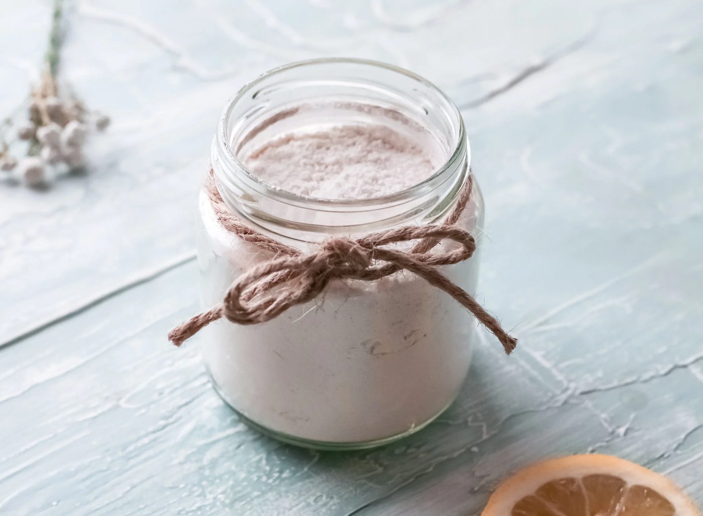 Handmade carpet deodorizer and freshener powder in a glass jar with twine