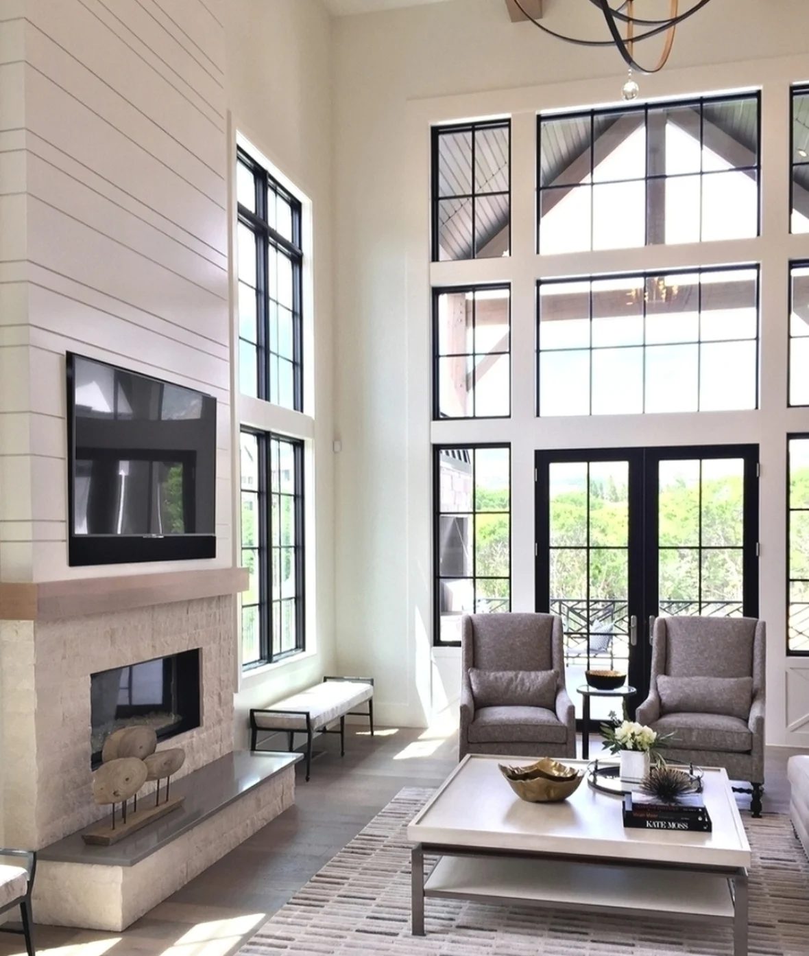 White Living Room With Fireplace And Windows