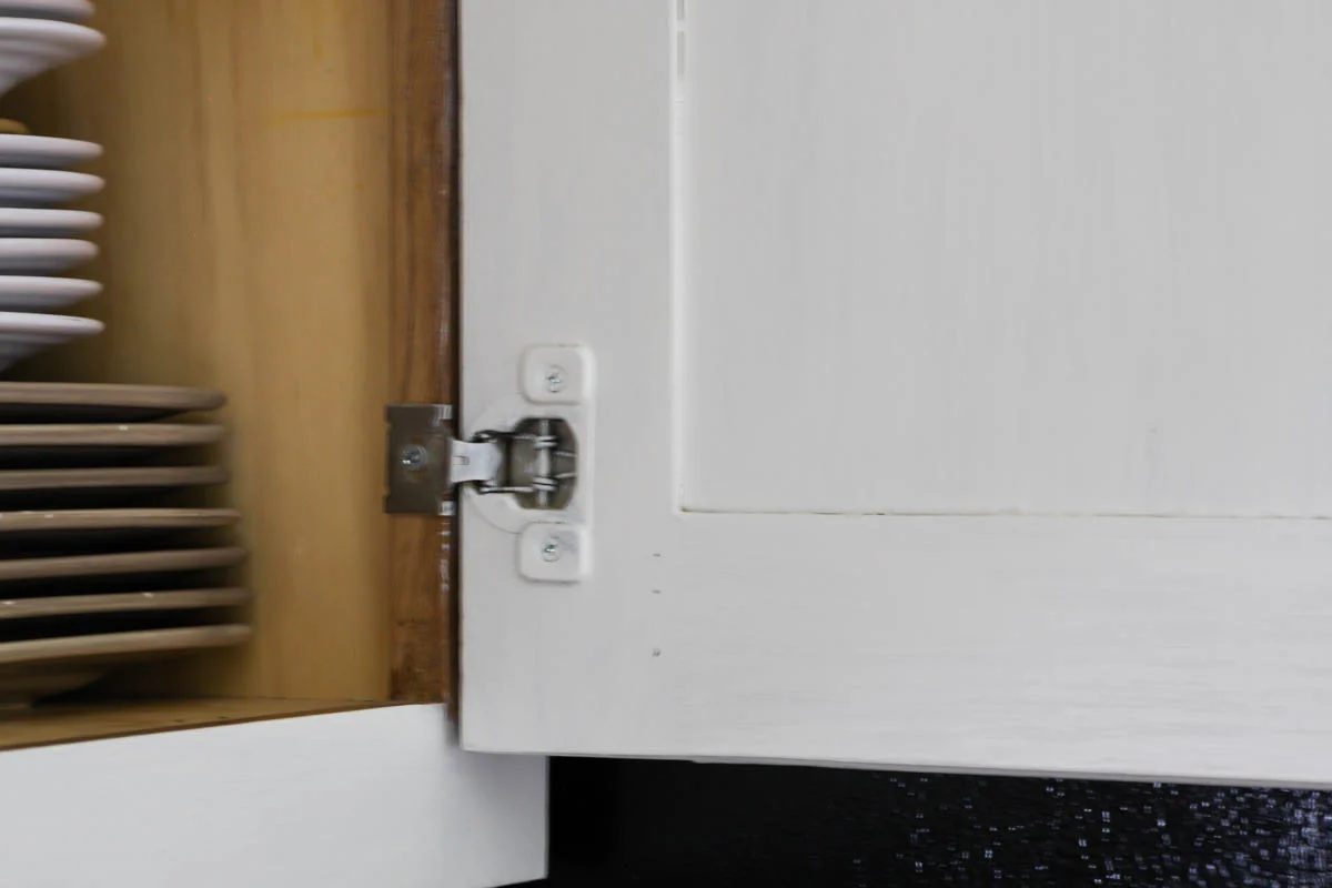 Paint kitchen cabinets white without removing doors by Vanessa's Modern Vintage Home featured on @Bekob