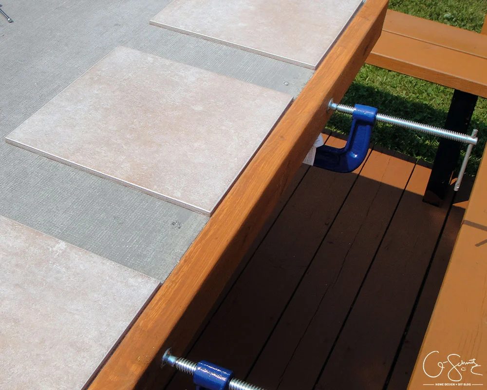 Handmade tiled table top with striking mosaic tile edges by Q-Schmitz featured on @Bekob