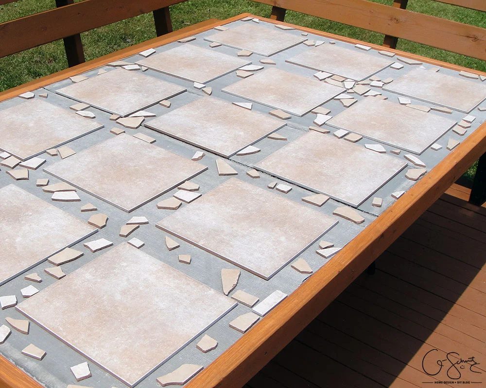 Handmade tiled table top with mosaic borders by Q-Schmitz featured on @Bekob