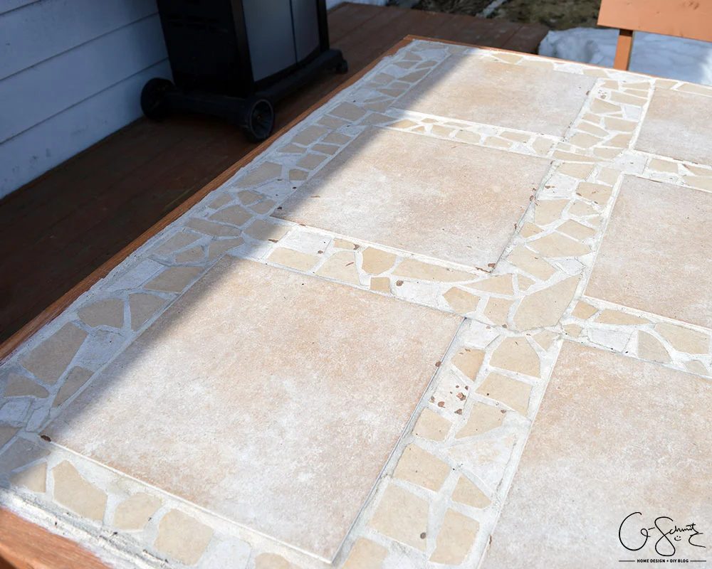 Handmade tiled table top with mosaic tile accents by Q-Schmitz featured on @Bekob