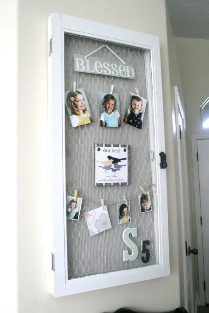 The House of Smiths - old window into hinged chicken wire photo holder - via Bekob