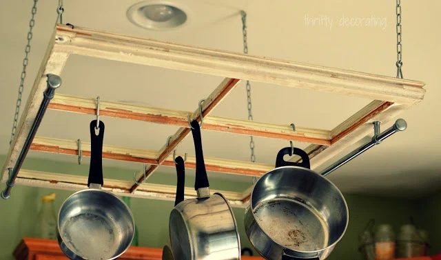 The Frugal Girls - old window into a kitchen pot rack - via Bekob