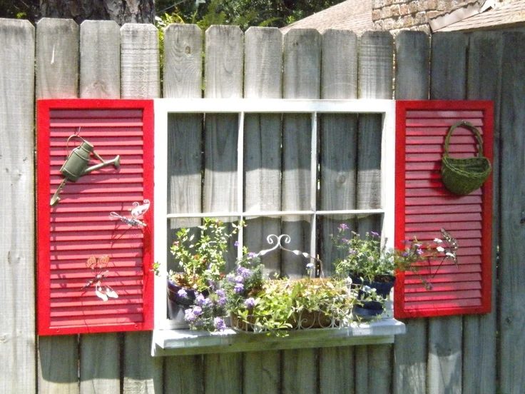 source unknown - old window with sill and shutters on fence - via Bekob