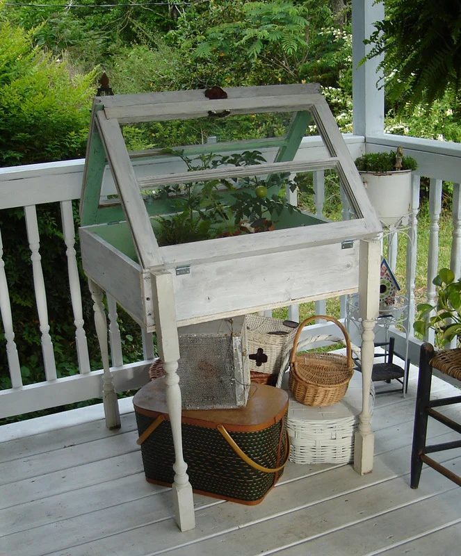 via Robo Margo - outdoor greenhouse table from old windows - via Bekob