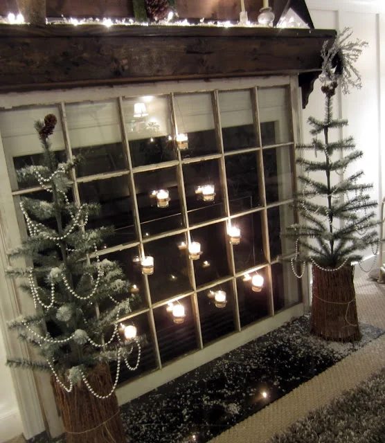 Down to Earth Style - old window as fireplace cover with candles - via Bekob