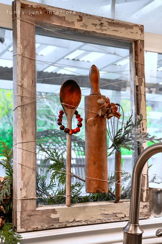 Funky Junk Interiors - old window as a memorabilia holder or seasonal display with twine - via Bekob