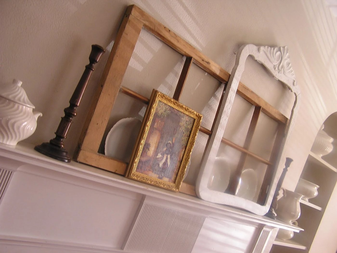 One Girl Three Brothers - old window layered on mantel - via Bekob