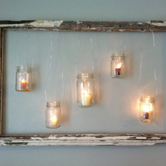 via Beauty and Bedlam - hang mason jars and tealights in an old window - via Bekob