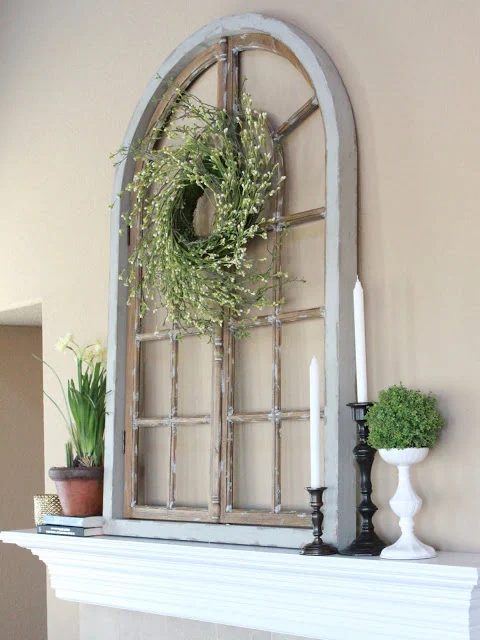 The Sweet Survival - use an old mirror to hang a wreath on the mantel - via Bekob