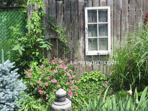 via Empress of Dirt - old window hung on fence - via Bekob