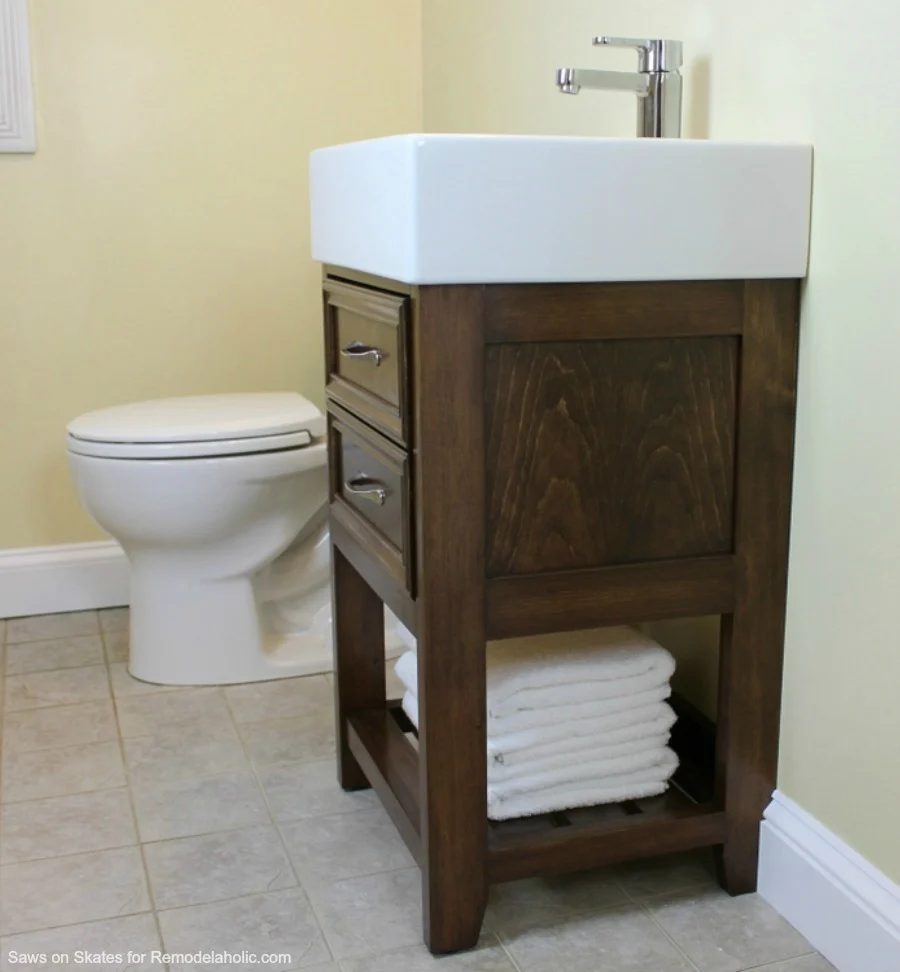 Build a small vanity with an IKEA sink -- and it has both open storage on the bottom AND a hidden storage cabinet behind two false drawer fronts.