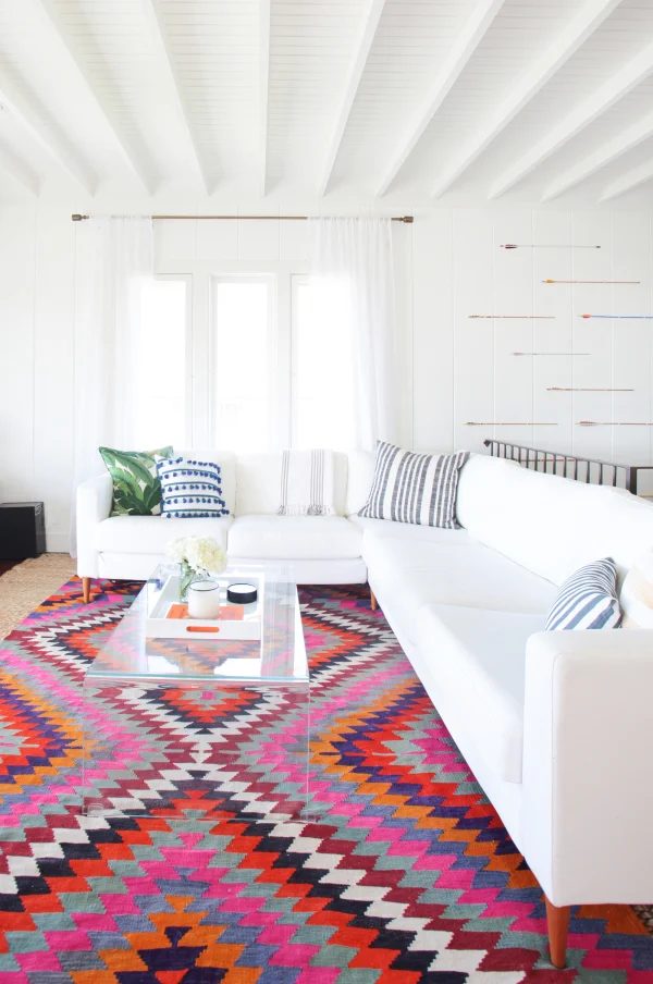 white and colorful southwestern style living room via StyleMePretty, photo Tessa Neustadt