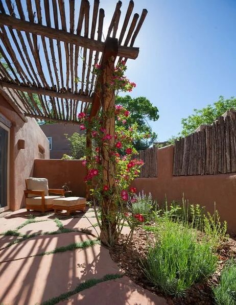 striking rustic arbor and fence by Violante & Rochford Interiors, photo credit © Wendy McEahern