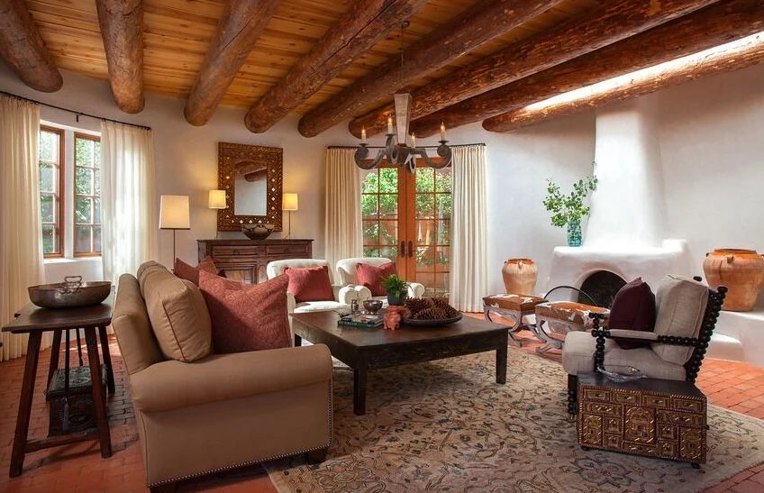 modernized southwest living area with adobo oven and log ceiling beamsby Violante & Rochford Interiors, photo credit © Wendy McEahern