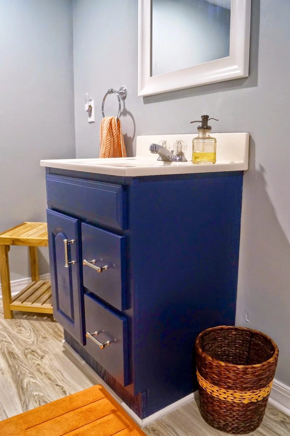 bathroom renovation with blue vanity - Old House to New Home via @Bekob