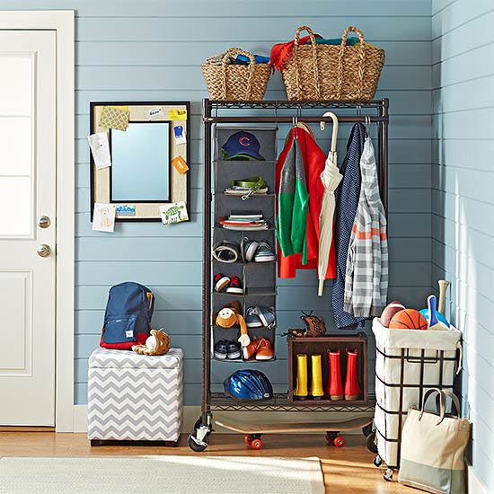 organized entryway with a rolling coat rack closet and baskets | 100+ striking Mudrooms and Entryways at Bekob.com
