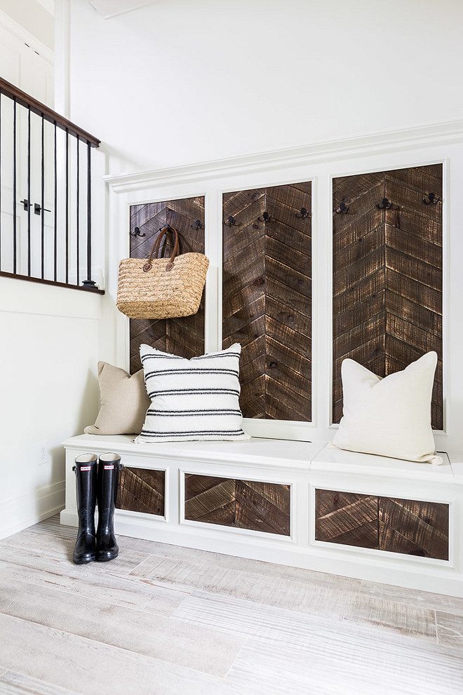 Love the reclaimed wood accent on this built-in! The herringbone style is striking. | 100+ striking Mudrooms and Entryways at Bekob.com