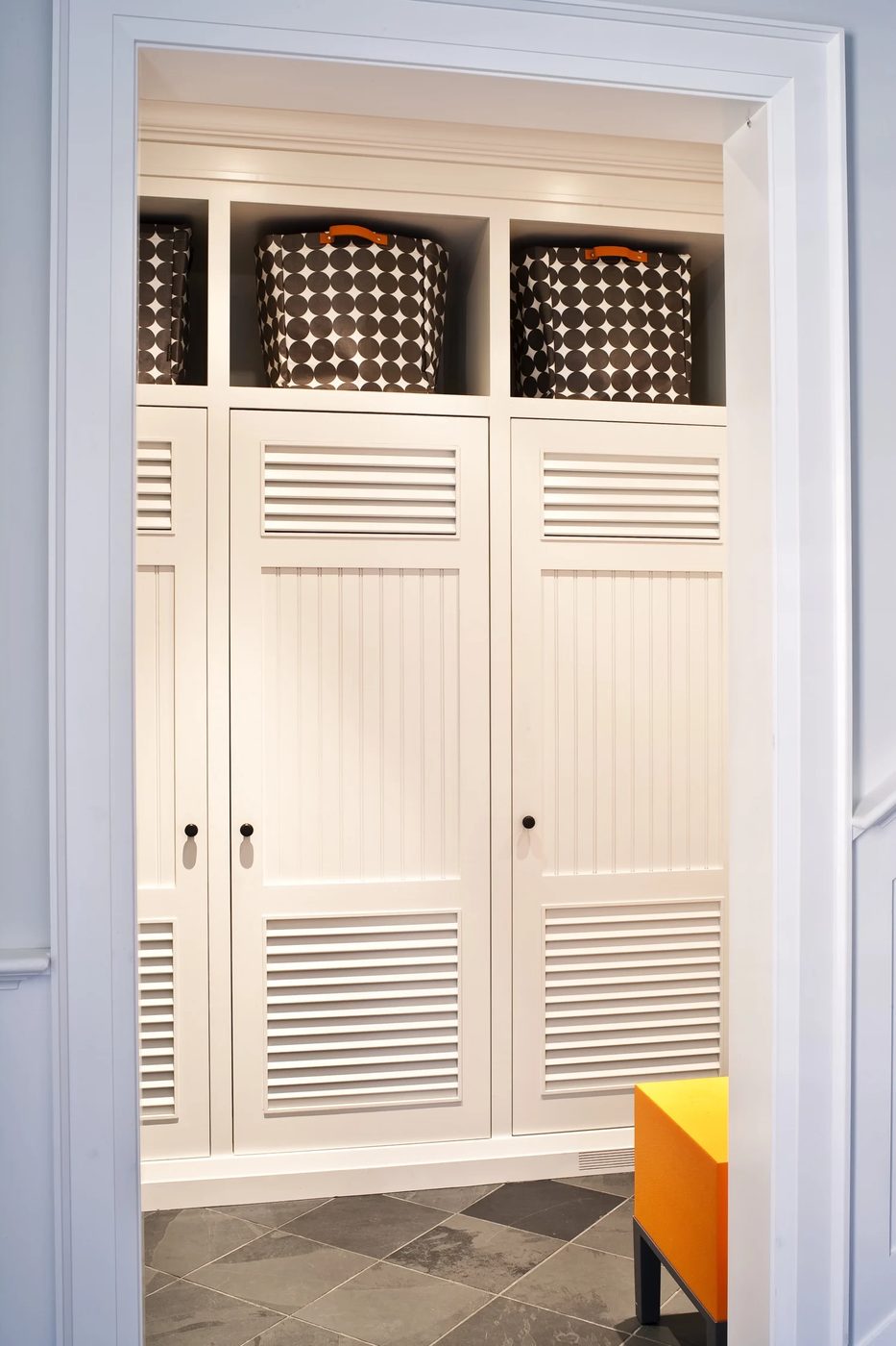 mudroom lockers with doors, baskets above. so much storage! | 100+ striking Mudrooms and Entryways at Bekob.com