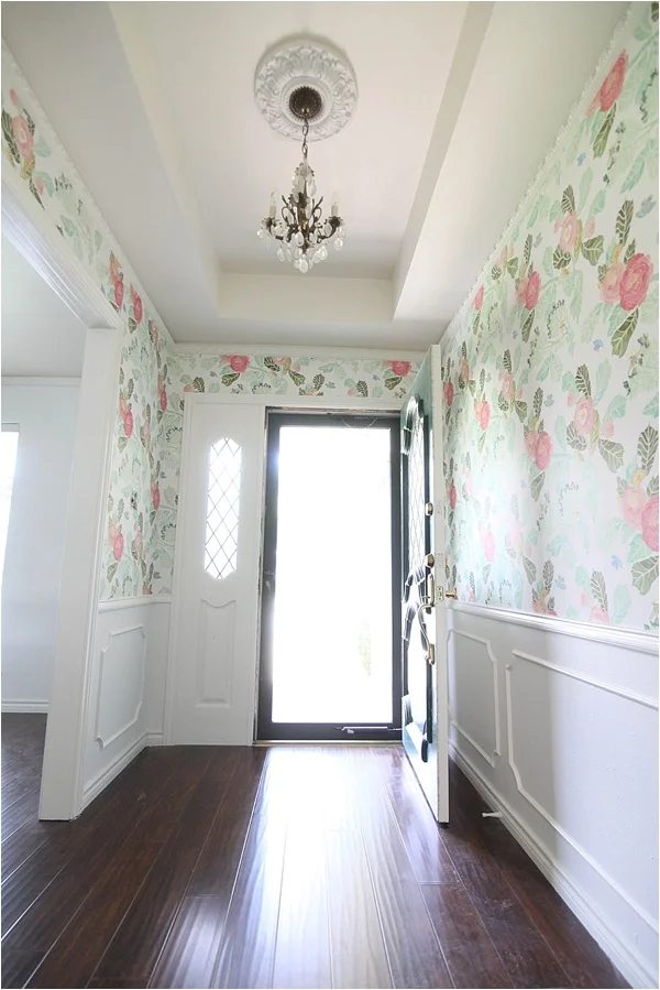 This wallpaper is memorable! Looks great with the wood floors and classic white wainscoting in the entry | 100+ striking Mudrooms and Entryways at Bekob.com