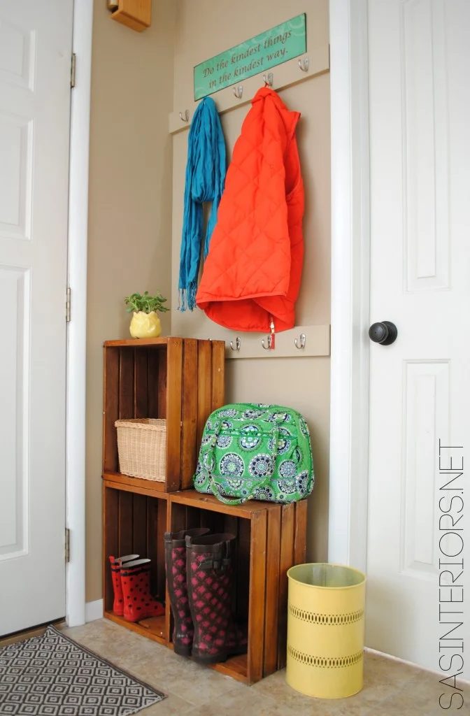 So straightforward! Stacked crates plus wall hooks fora mini mudroom | 100+ striking Mudrooms and Entryways at Bekob.com