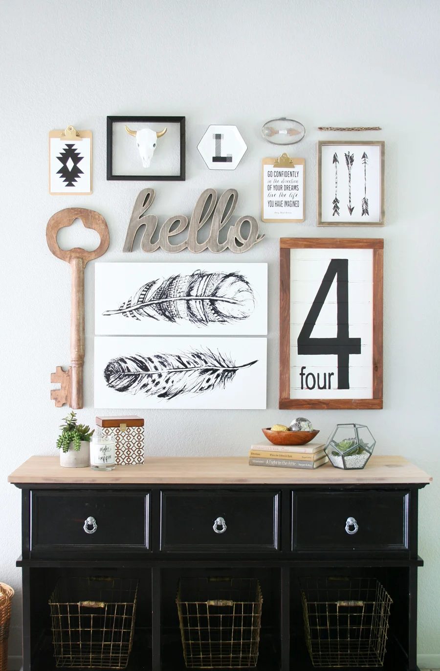 I love this neutral gallery wall and that table is well fitted for an entry | 100+ striking Mudrooms and Entryways at Bekob.com