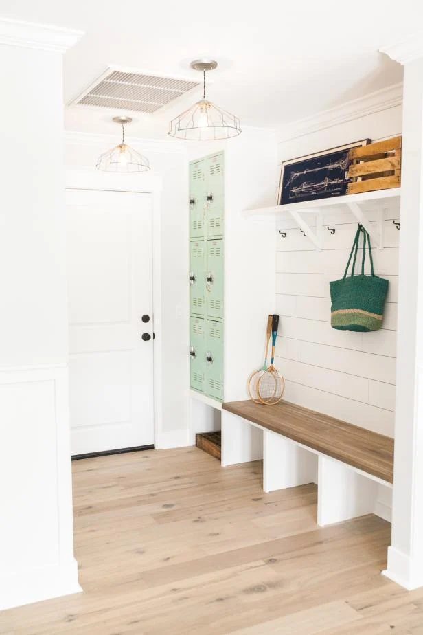 large white mudroom, shoplap, lockers, and a storage bench. LOVE! | 100+ striking Mudrooms and Entryways at Bekob.com