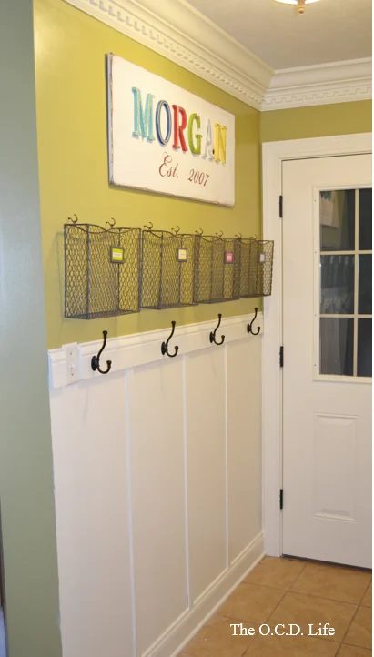 solid entryway command center with wire baskets and hooks above the board and batten | 100+ striking Mudrooms and Entryways at Bekob.com