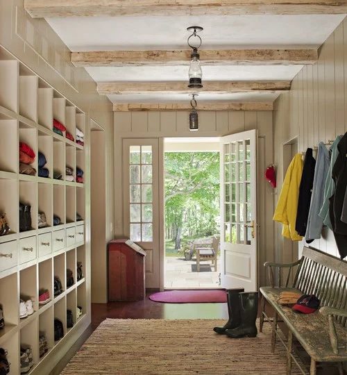 Farmhouse style entry, love the beams and LOOK at all the storage in those cubbies! | 100+ striking Mudrooms and Entryways at Bekob.com