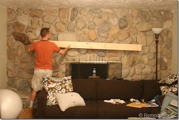 Installing a wood mantel on a stone or brick fireplace wall before