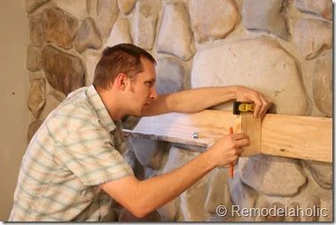 Installing a wood mantel on a stone wall (44)