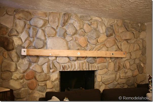 Installing a wood mantel on a stone wall (58)