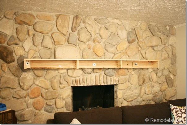 Installing a wood mantel on a stone wall (66)