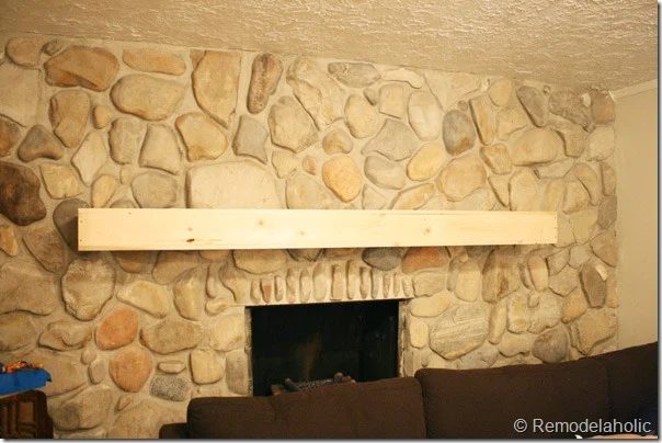 Installing a wood mantel on a stone wall (75)