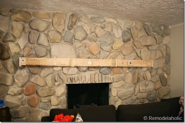 Installing a wood mantel on a stone wall (60)
