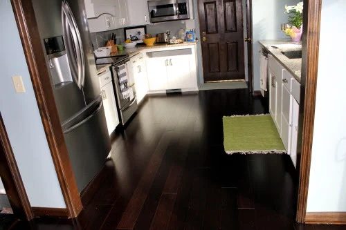 finished kitchen renovation with white cabinets and new wood flooring, construction2style on @Bekob
