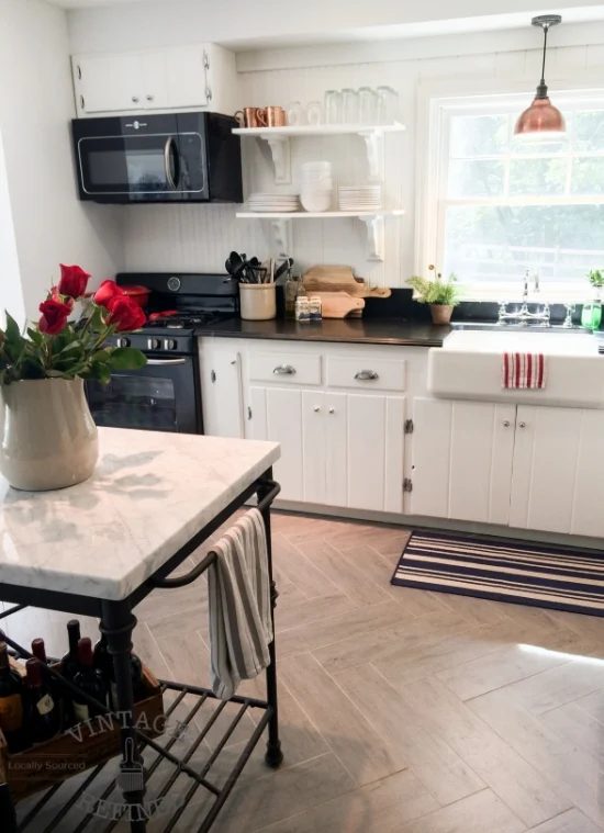 Herringbone floors in white kitchen renovation, by Vintage Refined featured on @Bekob